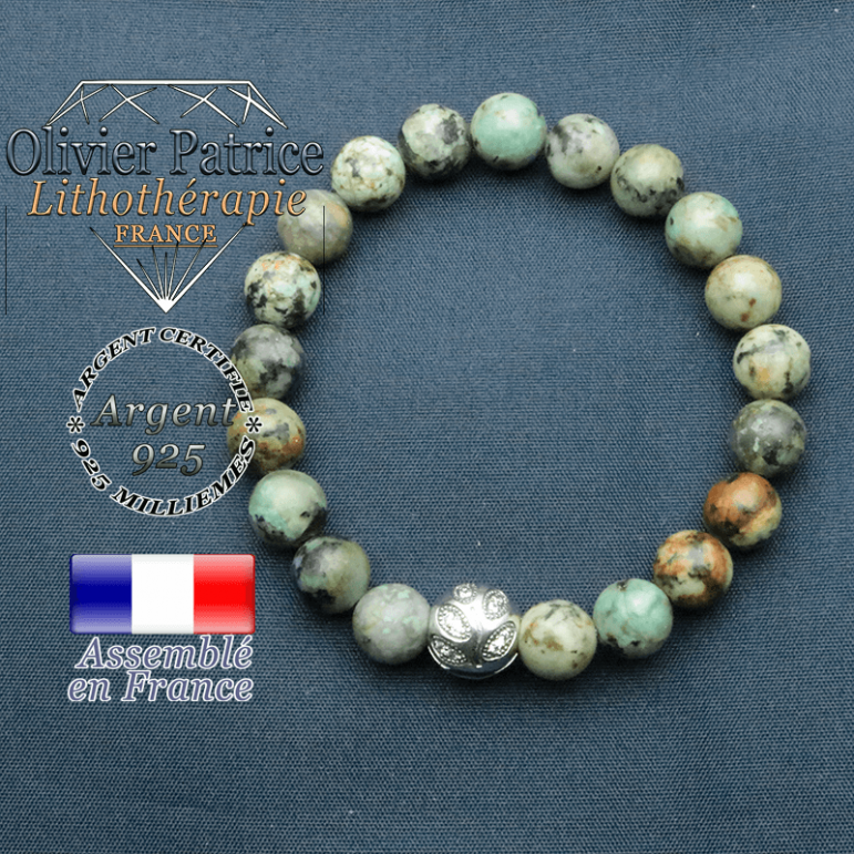 Bracelet surmonté de sa boule gravée de feuilles en argent 925 en pierre naturelle en turquoise bleue africaine