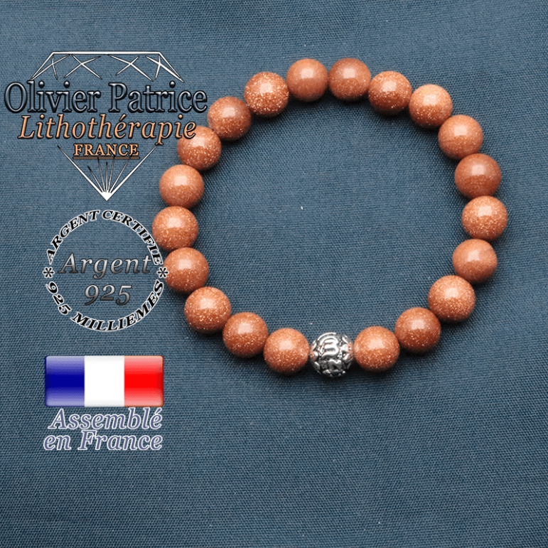 bracelet en pierre naturelle en goldstone et sa boule de finition om mani en argent plaqué