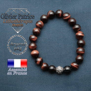 bracelet en pierre naturelle en oeil de taureau et sa boule de finition om mani en argent plaqué