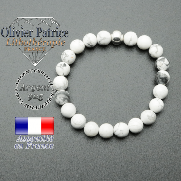 bracelet en pierre naturelle et sa finition boule lisse en argent 925 sa pierre est en howlite