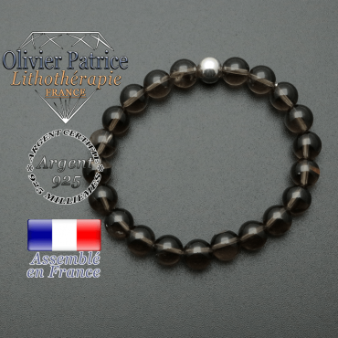 bracelet en pierre naturelle et sa finition boule lisse en argent 925 sa pierre est en quartz fume